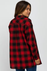 woman wearing a red and black plaid maternity shirt, visible baby bump, viewed from the back