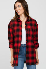 woman wearing a red and black plaid button-up shirt with rolled sleeves and a white tank top underneath