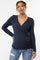 woman wearing a navy blue long sleeve maternity wrap top with a fitted silhouette and ruched side detail, showcasing her baby bump