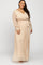 Plus size woman wearing a long sleeve beige wrap maxi dress with a waist tie