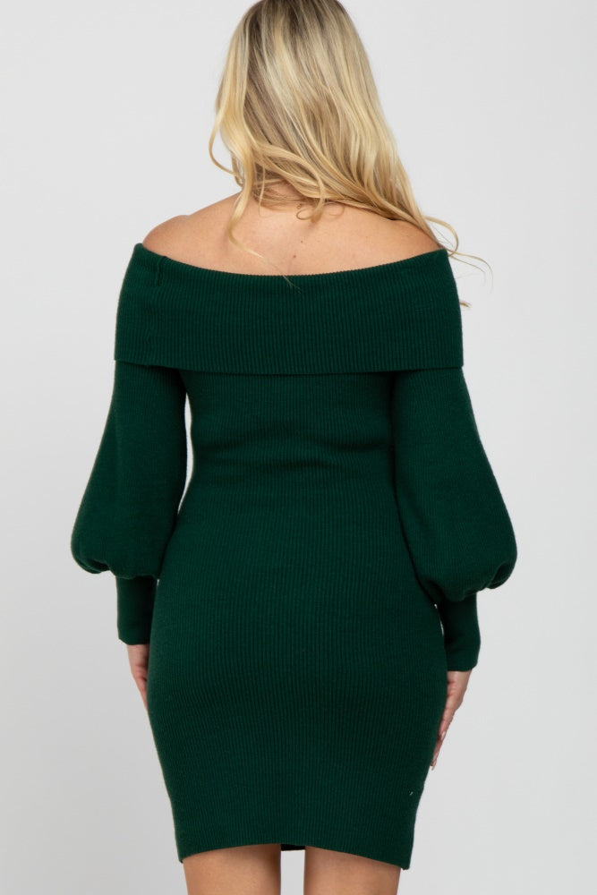 woman wearing a dark green off-the-shoulder ribbed maternity dress with puff sleeves