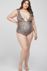 woman wearing a leopard print maternity swimsuit with a deep v-neck and a visible baby bump