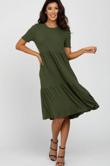 woman wearing olive green short sleeve tiered ribbed midi dress and black strappy heels