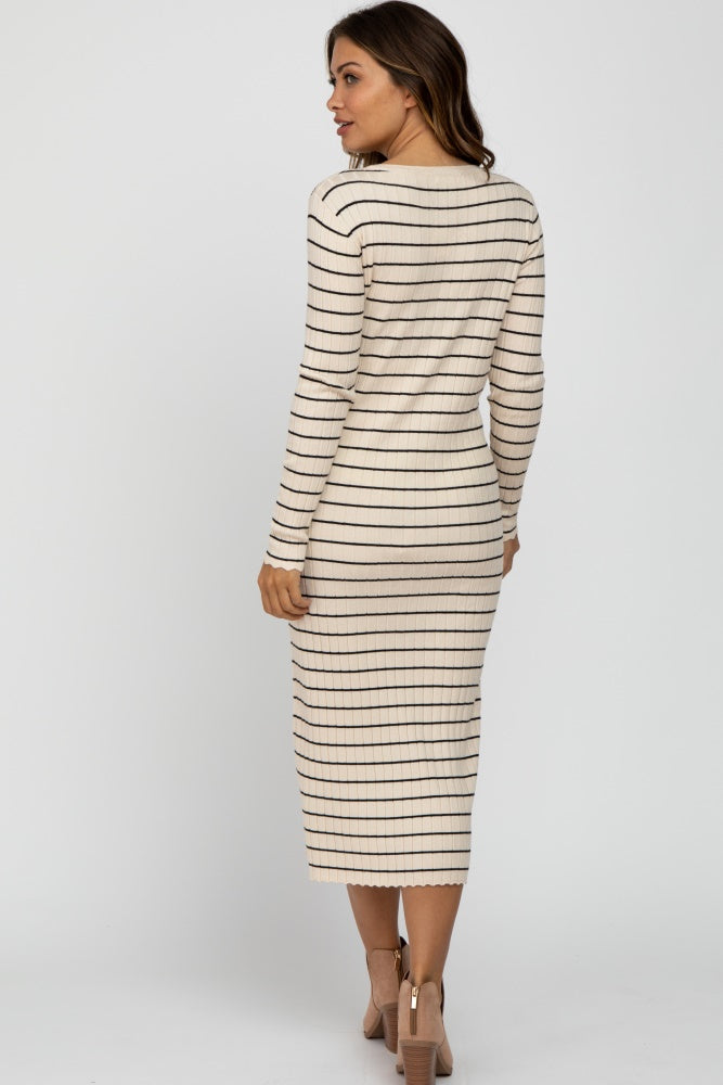 woman wearing a beige striped maternity dress with long sleeves and a fitted silhouette, showcasing a baby bump visible from the back