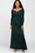 woman wearing a dark green long sleeve maxi dress with a sweetheart neckline and fitted bodice