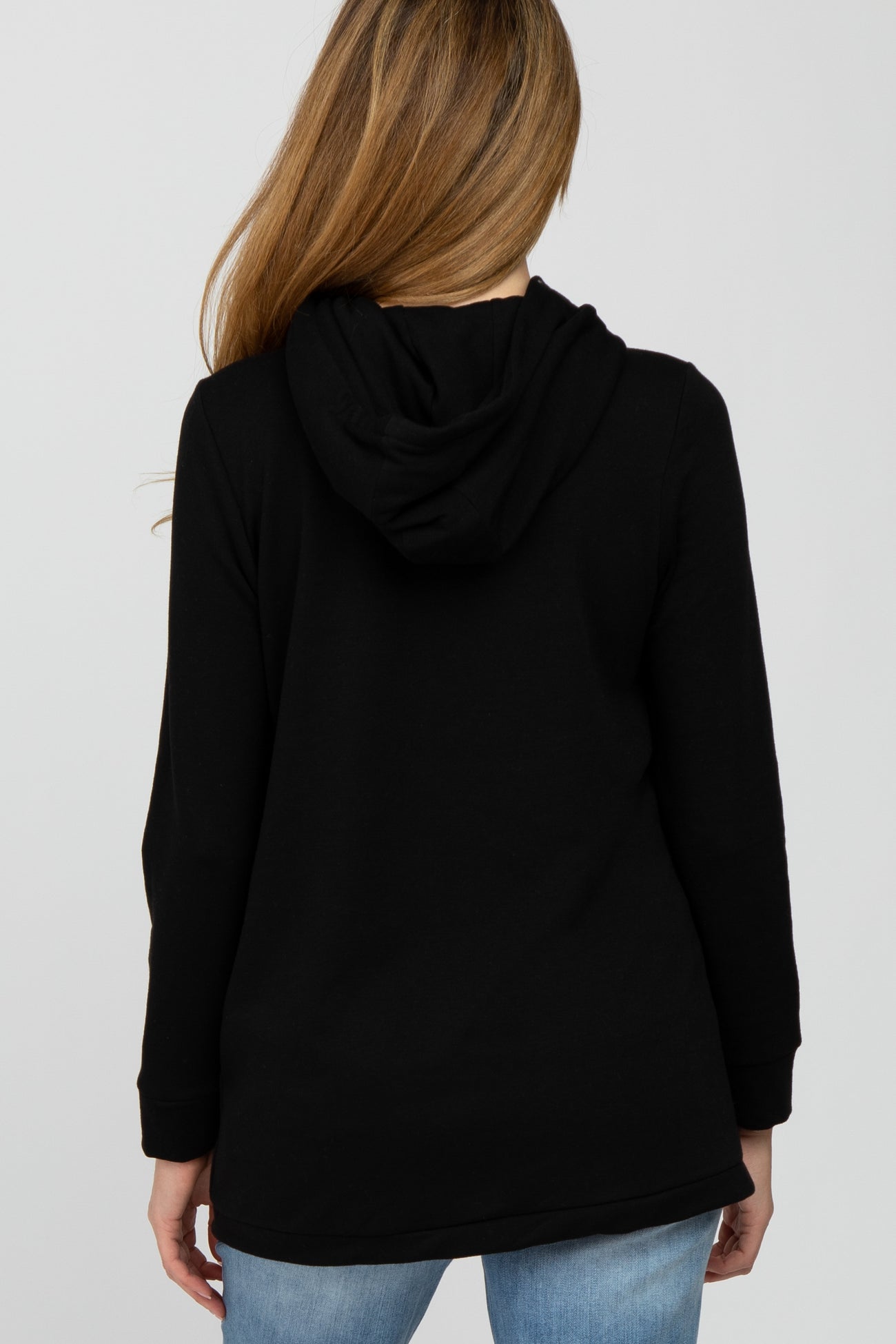 woman wearing a black maternity hoodie with a relaxed fit and a hood, viewed from the back