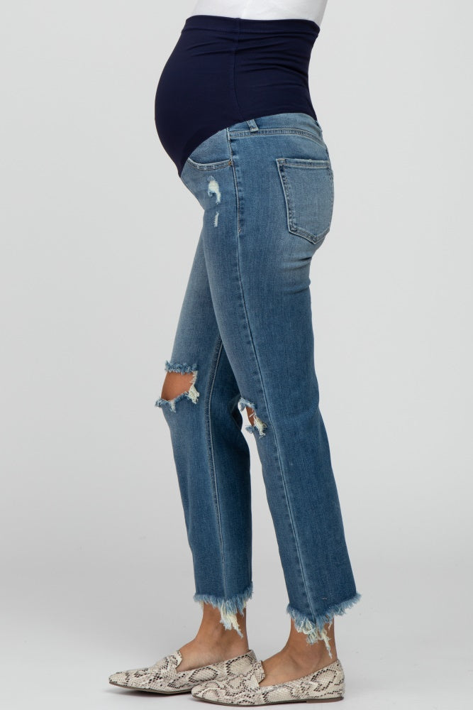 maternity wear dark blue over-the-bump jeans with distressed detail and frayed hem, model showing baby bump