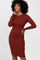 woman wearing a fitted ribbed long sleeve midi dress in burgundy