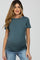 woman wearing a teal maternity t-shirt with short sleeves and a visible baby bump