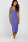 woman wearing a lavender ribbed midi dress with a v-neckline and white sneakers