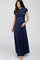 woman wearing a navy blue short sleeve maternity maxi dress and cradling her baby bump