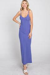 woman wearing a long purple ribbed maxi dress with spaghetti straps and a relaxed fit