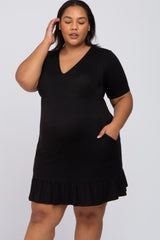 woman wearing a black maternity plus dress with a v-neck and ruffled hem, highlighting her baby bump