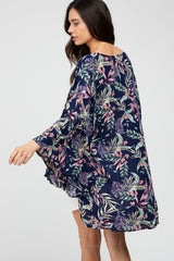 woman wearing a navy floral maternity kimono with open sleeves
