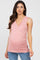 woman wearing a light pink sleeveless maternity top with a cross-over design and baby bump visible