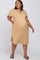 plus size woman wearing a tan short sleeve henley maternity dress and sandals