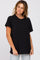 woman wearing a relaxed fit black short sleeve t-shirt with a round neckline and a casual style