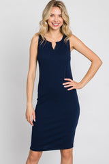 woman wearing a navy blue sleeveless ribbed midi dress with a keyhole neckline