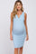 pregnant woman wearing a light blue ribbed sleeveless maternity dress with a notched neckline