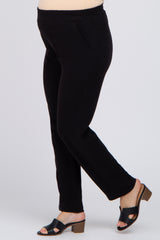 woman wearing black maternity pants with a comfortable waistband and side pockets
