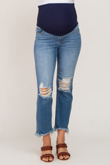 woman wearing maternity distressed straight-leg jeans with a navy blue belly band and frayed hems