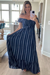 woman wearing a navy blue off-the-shoulder striped maxi dress with a tied waist and ruffled hem