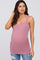 Pregnant woman wearing a mauve scoop neck maternity tank top with side ruching and distressed jeans