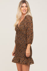 Woman wearing a long sleeve floral print mini dress with a ruffled hem and v-neckline