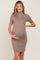 Pregnant woman wearing a taupe short sleeve ribbed maternity mini dress with a mock neckline