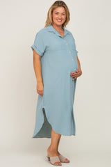 pregnant woman wearing a light blue button down maternity midi dress with short sleeves