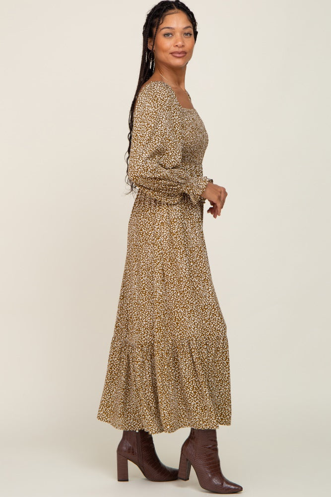 woman wearing olive green leopard print smocked maternity maxi dress with brown boots