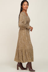 woman wearing olive green leopard print smocked maternity maxi dress with brown boots