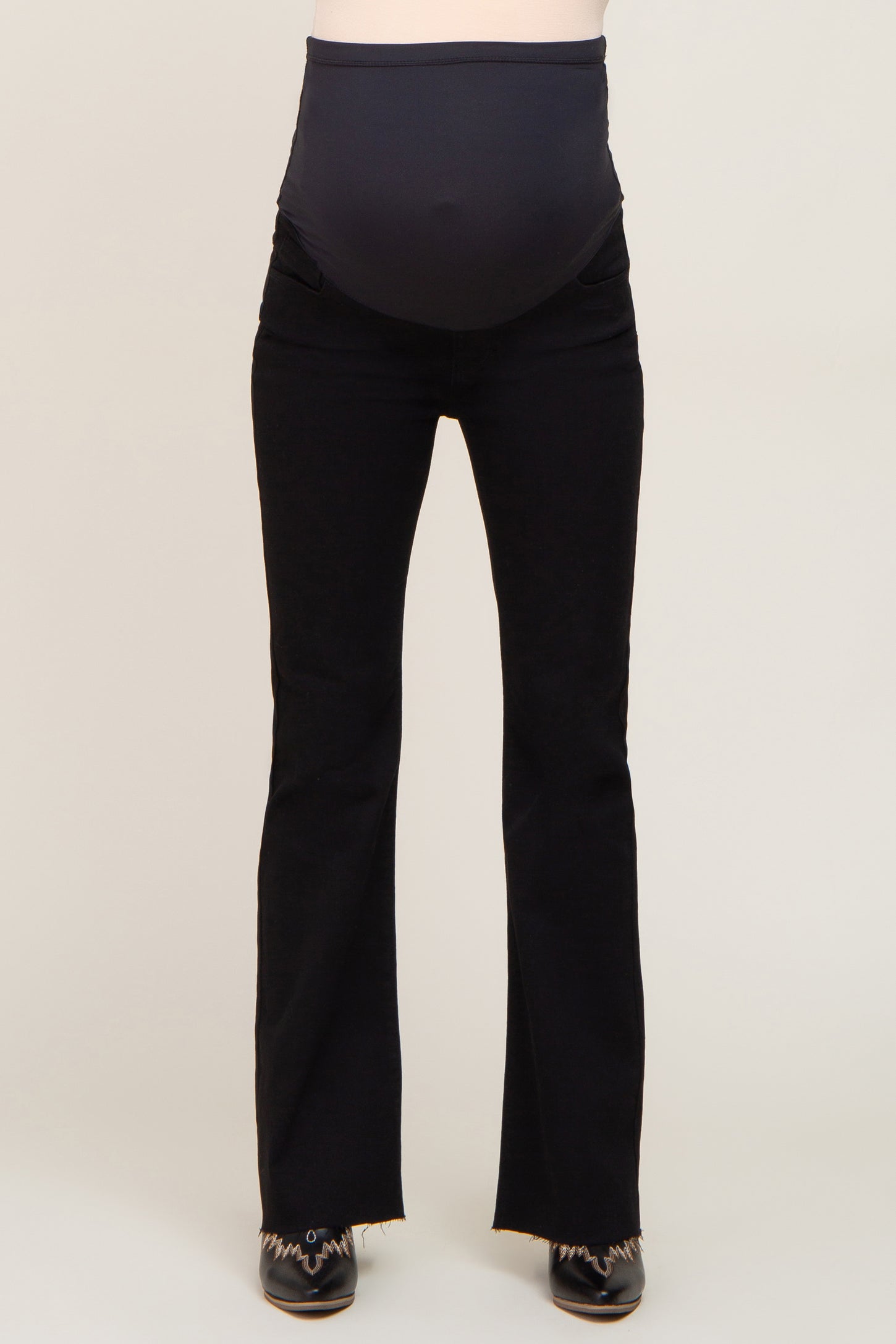 maternity wear black flared jeans with a stretchy waistband designed for a baby bump