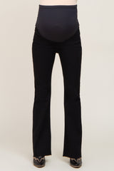 maternity wear black flared jeans with a stretchy waistband designed for a baby bump