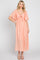 woman wearing a peach maxi dress with flutter sleeves and a tie-front detail