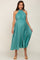 pregnant woman wearing a teal pleated halter neck maternity midi dress with a waist tie
