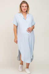 pregnant woman wearing light blue short sleeve button down maternity midi dress and white sneakers