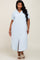 woman wearing a light blue short sleeve button down midi dress with collar and front pockets