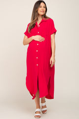 Pregnant woman wearing a red short sleeve button down maternity midi dress with side slits and white sandals