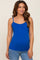 woman wearing a royal blue maternity tank top with adjustable straps and a side ruching detail