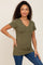 woman wearing olive green v-neck short sleeve t-shirt and blue jeans