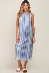 pregnant woman wearing a blue and white vertical striped sleeveless maternity midi dress with white sandals