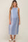 pregnant woman wearing a blue and white vertical striped sleeveless maternity midi dress with white sandals