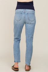 Back view of light wash maternity straight leg jeans with a navy blue elastic belly band