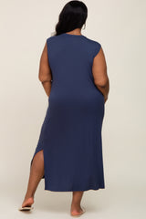 woman wearing a navy blue sleeveless maxi dress with a side slit, viewed from the back