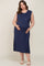 woman wearing a navy blue sleeveless maternity dress with side slits and a pocket, showcasing her baby bump