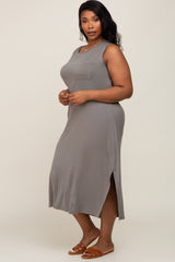 woman wearing a gray sleeveless maxi dress with a side slit and a chest pocket