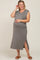 woman wearing a gray maternity dress with a v-neck, short sleeves, and side slits, showing her baby bump