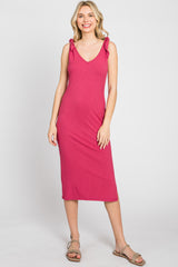 woman wearing a sleeveless magenta ribbed midi dress with shoulder ties and tan sandals