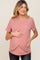 woman wearing a mauve short sleeve maternity and nursing top with crossover detail